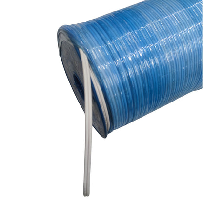 A close-up of a spool of translucent blue cord or wire, with a single strand unwinding vertically against a plain white background.