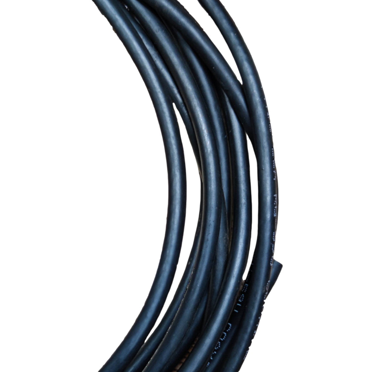 A coiled bundle of thick black cable or wire on a plain white background.