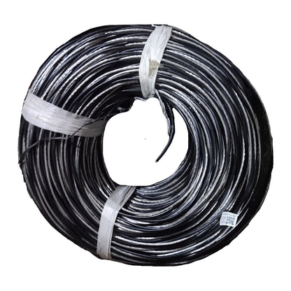 Coiled black cable with a white connector on a white background