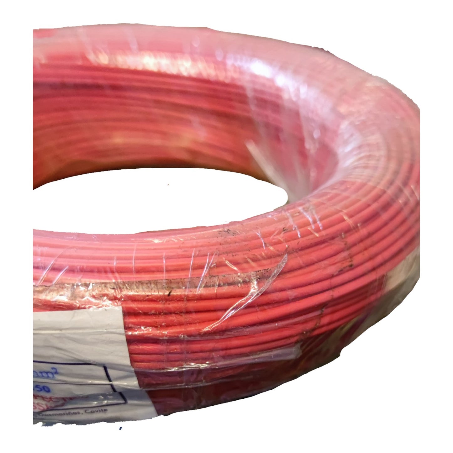 Red electrical cable coiled on a white background