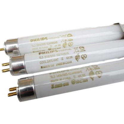 Three Philips fluorescent light bulbs on a white background