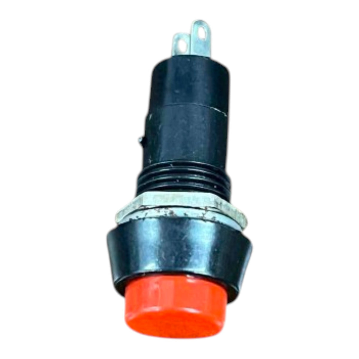 An industrial push-button symbol switch with a black plastic housing, a red button cover, and silver metal terminal posts at the top, isolated on a white background.