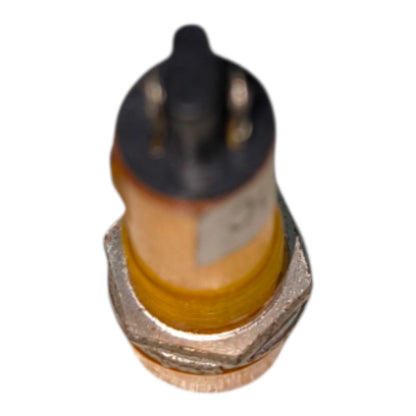 A small cylindrical automotive sensor or component with a black top, metallic silver base, and a yellow-orange body, isolated on a white background.
