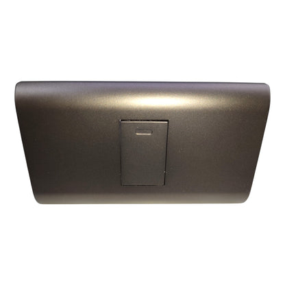 A dark gray plastic automotive interior trim piece with a central rectangular recessed panel, shown against a plain white background.