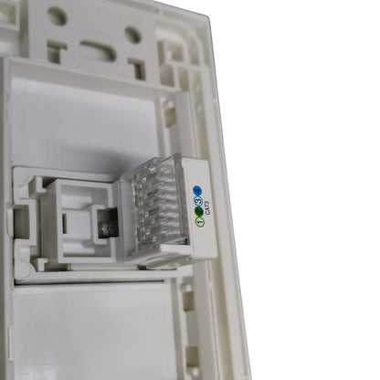 Close-up of a white RJ45 network module with an integrated status LED indicator showing blue, green, and white lights.