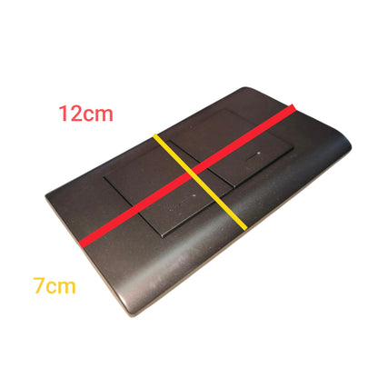 A dark brown rectangular electronic device, likely a remote control or switch panel, shown with red and yellow measurement lines and text indicating dimensions of 12cm and 7cm on a white background.