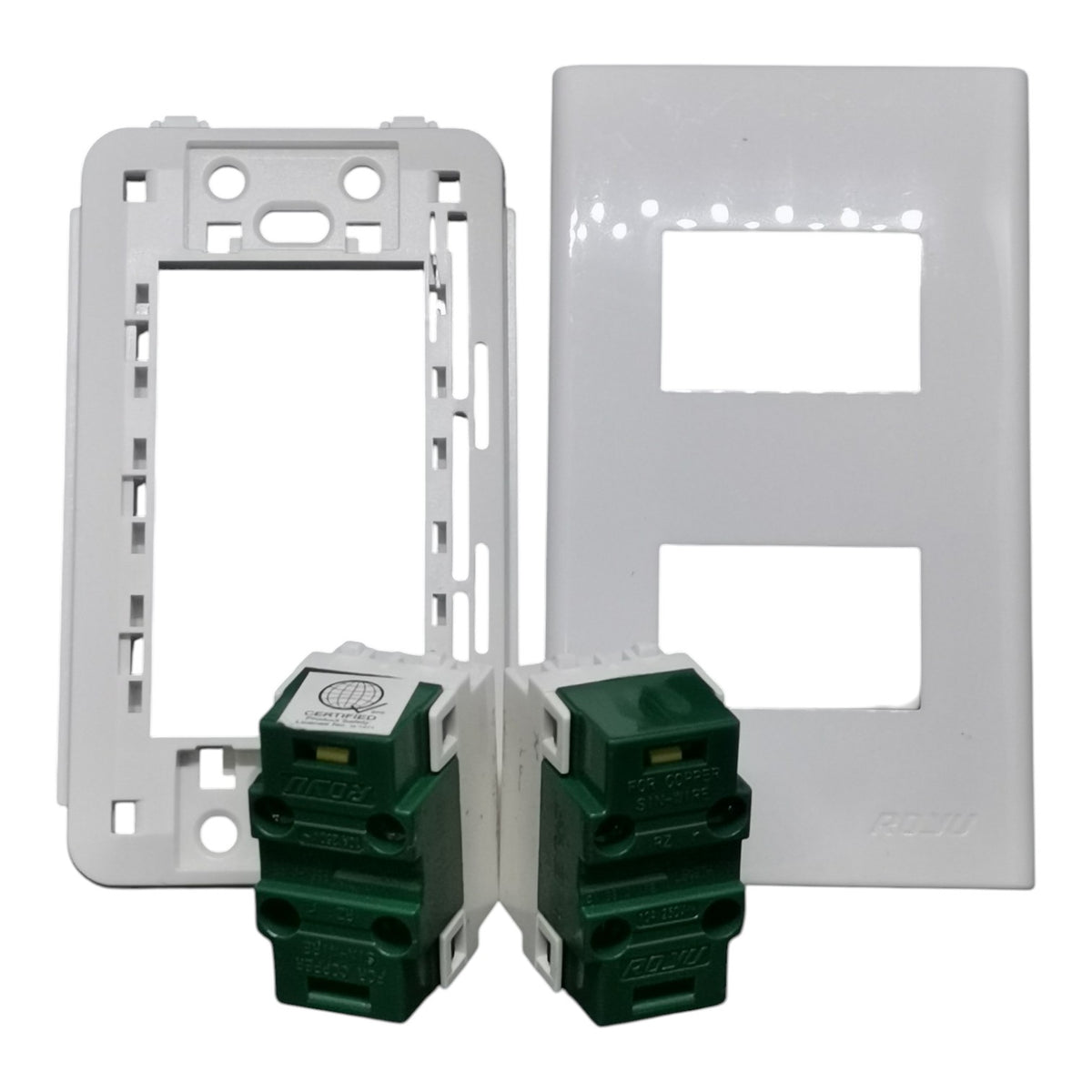 Two white electrical outlet plates shown with two green modular switch modules in front, photographed on a plain white background.