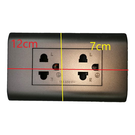 A dark gray wall outlet with overlaid dimension markings showing 12cm width and 7cm height on a plain white background.