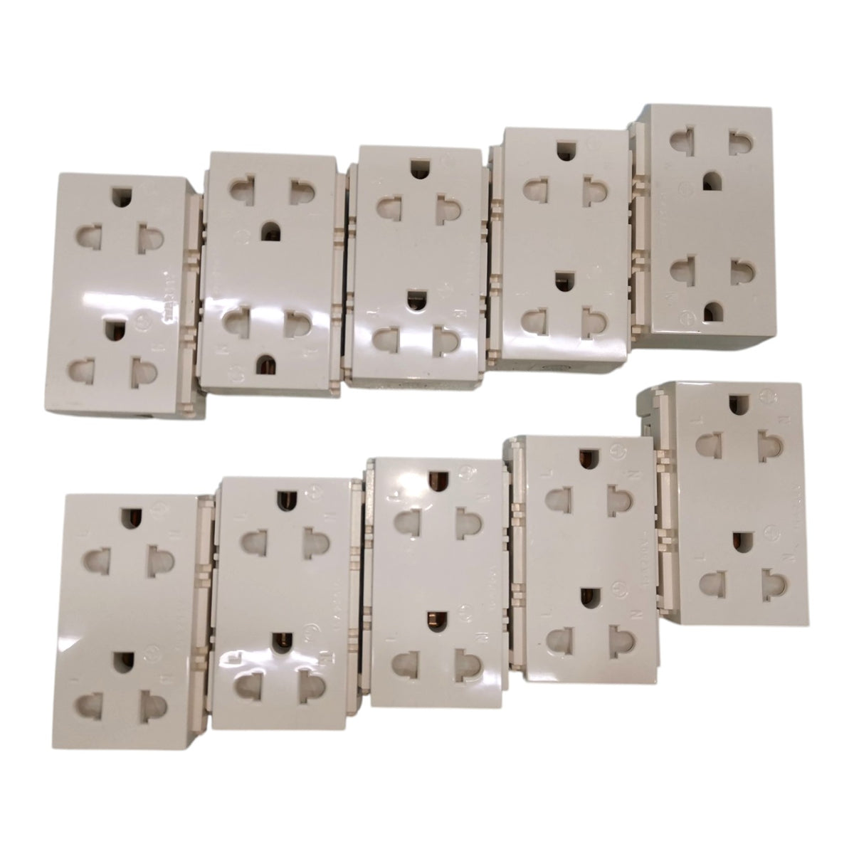 Six beige wall outlet blocks arranged in two rows on a plain white background.