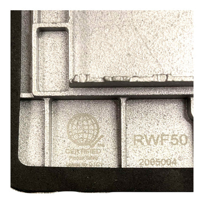 Close-up of a gray cast-metal component with molded cavities, featuring embossed text including 'RWF50', 'CERTIFIED', and 'Made in USA'.