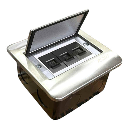 A recessed three-way light switch outlet with an open lid, featuring a brushed silver metal top cover and black switch components inside, shown on a plain white background.