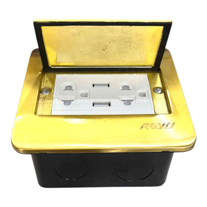 A waterproof outdoor duplex outlet box with a gold-colored top cover and a black base. The lid is open, revealing a white duplex outlet socket inside, with the brand name 'ROKU' printed on the front right side.