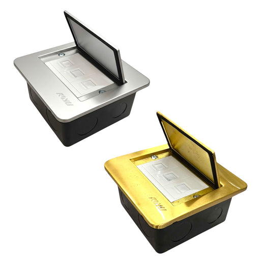 Two pop-up electrical outlet covers shown on a white background, one in silver and one in gold, both with black bases and open flip-up lids.