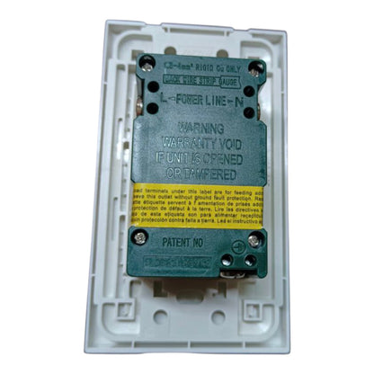 A 32-lead rigid ECG electrode connector block with a green metal connector plate, black screw terminals, and a yellow warning label, housed in a white plastic protective cover.