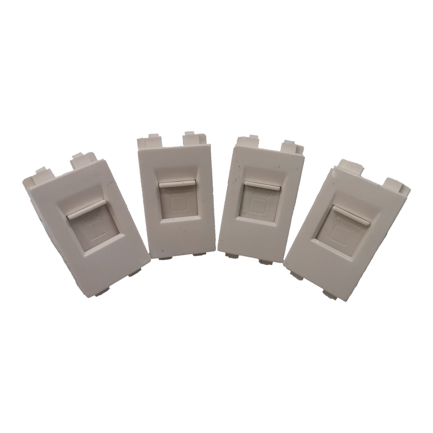 Four light gray plastic modular wall outlets arranged in a fan shape on a plain white background.