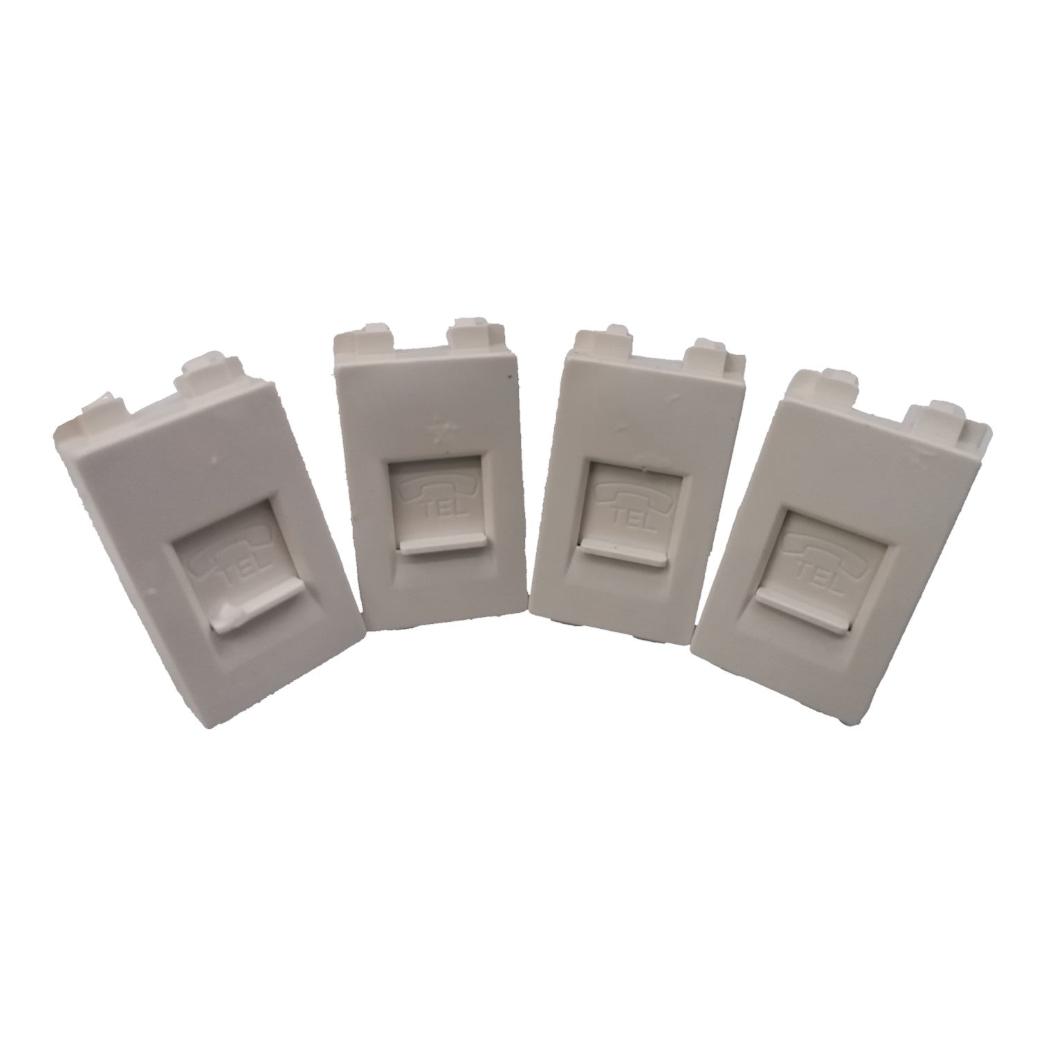 Four light gray plastic replacement parts with a rectangular recessed center, arranged in a fan shape on a white background.