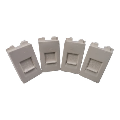 Four light gray plastic replacement parts with a rectangular recessed center, arranged in a fan shape on a white background.