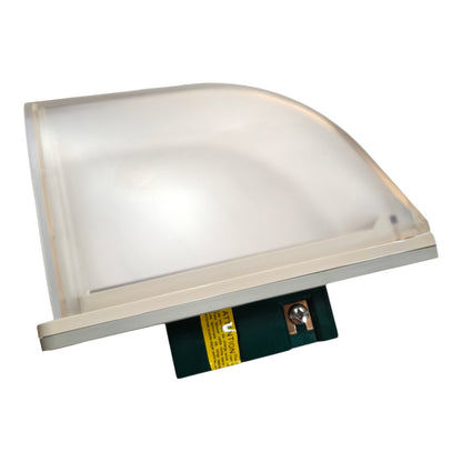 A square LED light fixture with a frosted translucent dome cover, a beige metal frame, and a green circuit board visible at the bottom with a yellow warning label.