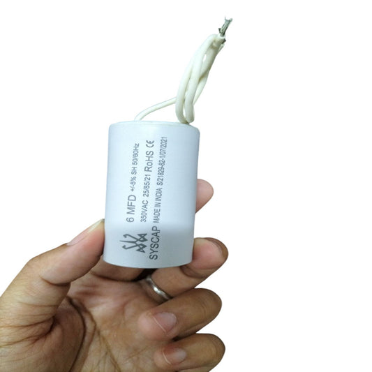 SYSCAP 350VAC Capacitor for Motors held in hand, ideal for electrical circuit applications