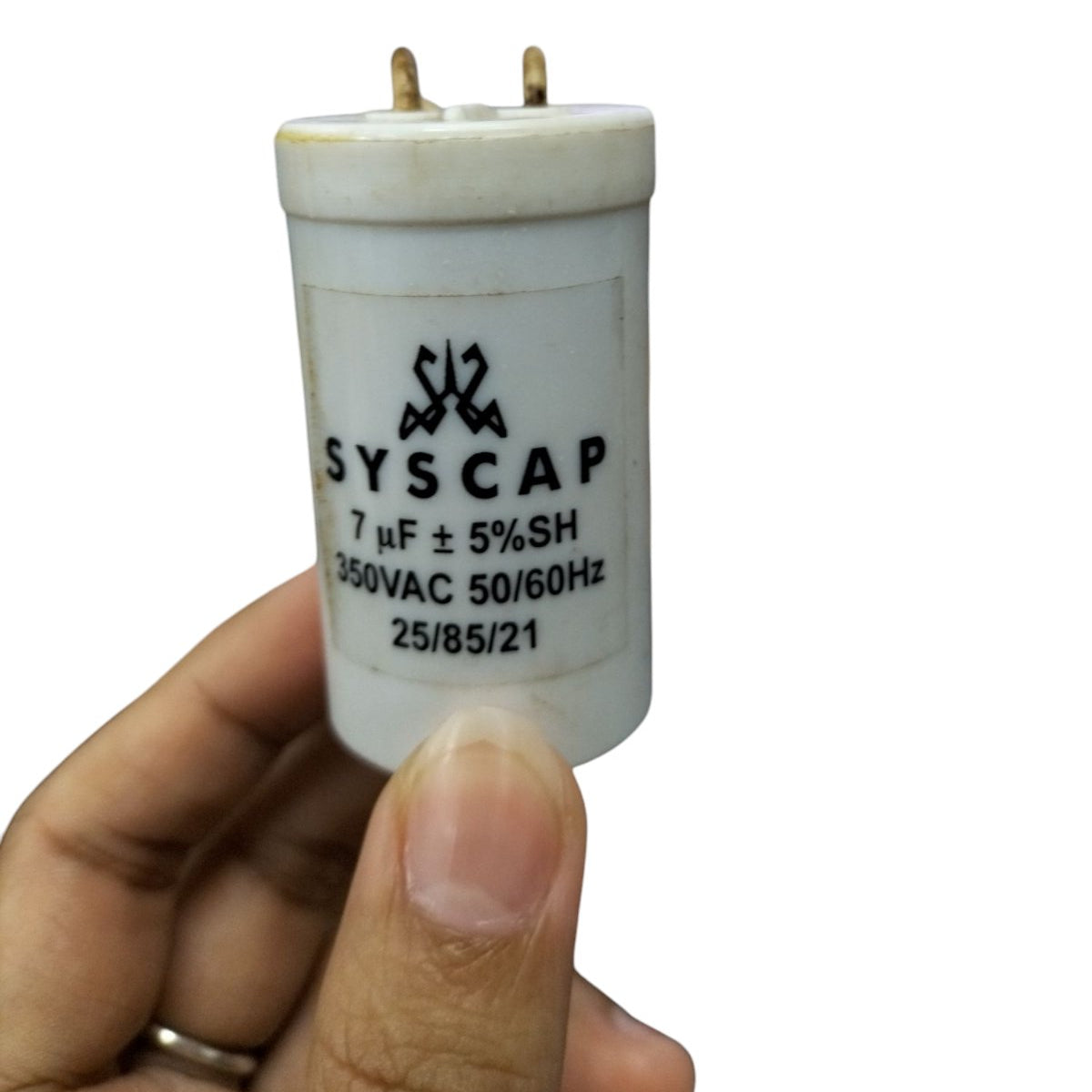 Syscap motor running capacitor 7uF 350V in hand, designed for efficient electrical performance