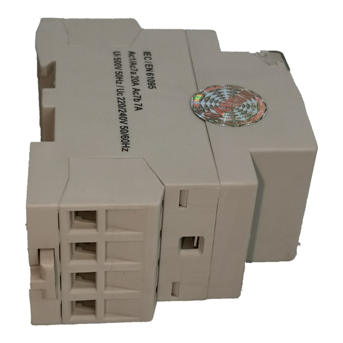 A beige industrial electronic module with a 4-pin terminal block on the front, printed specifications on the side, and a holographic sticker on top, shown against a plain white background.