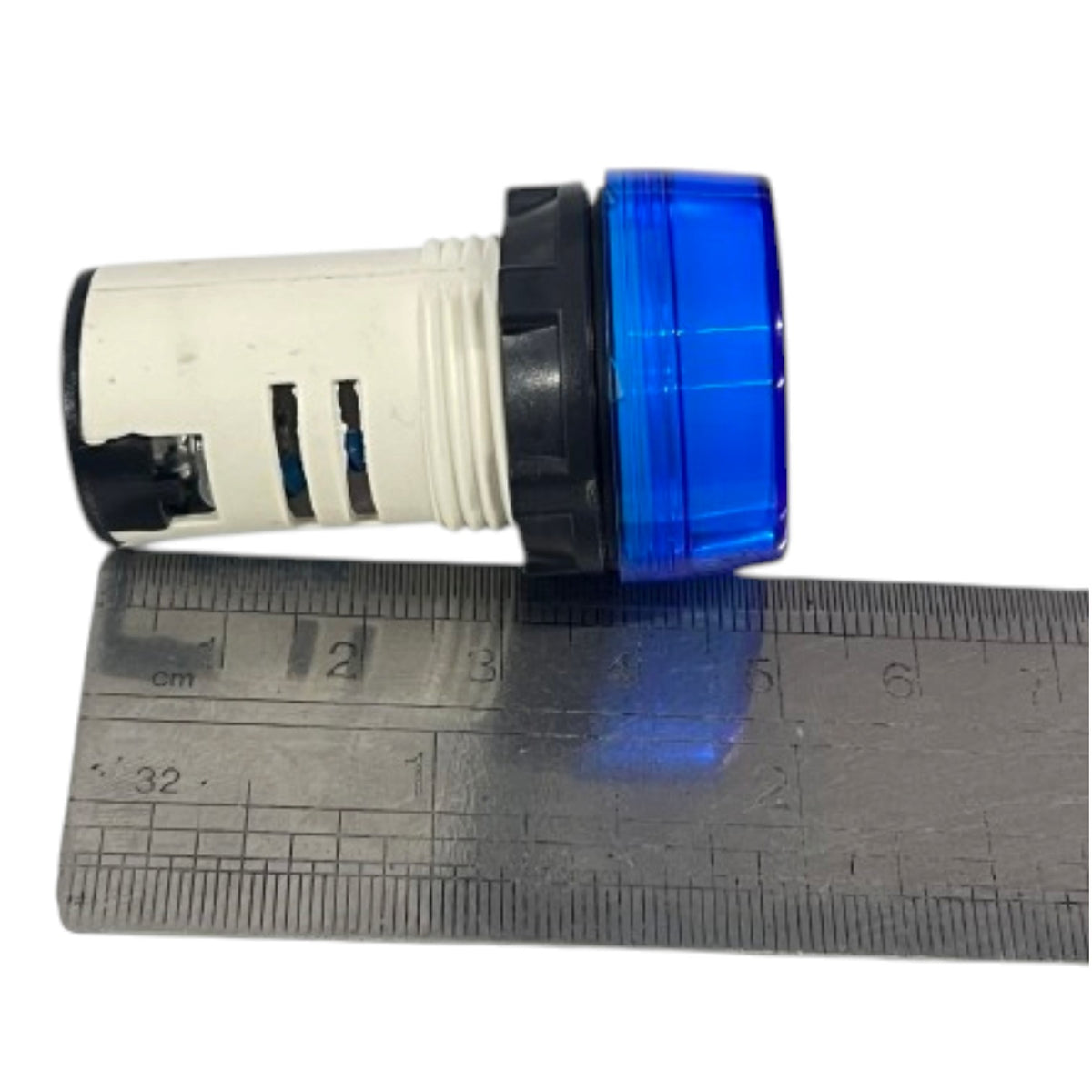 A small cylindrical blue and black plastic component placed next to a metal ruler on a white background.