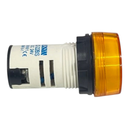 A KSN electrical push-button switch with a white body, black end caps, and an amber plastic lens on the front, shown against a plain white background.