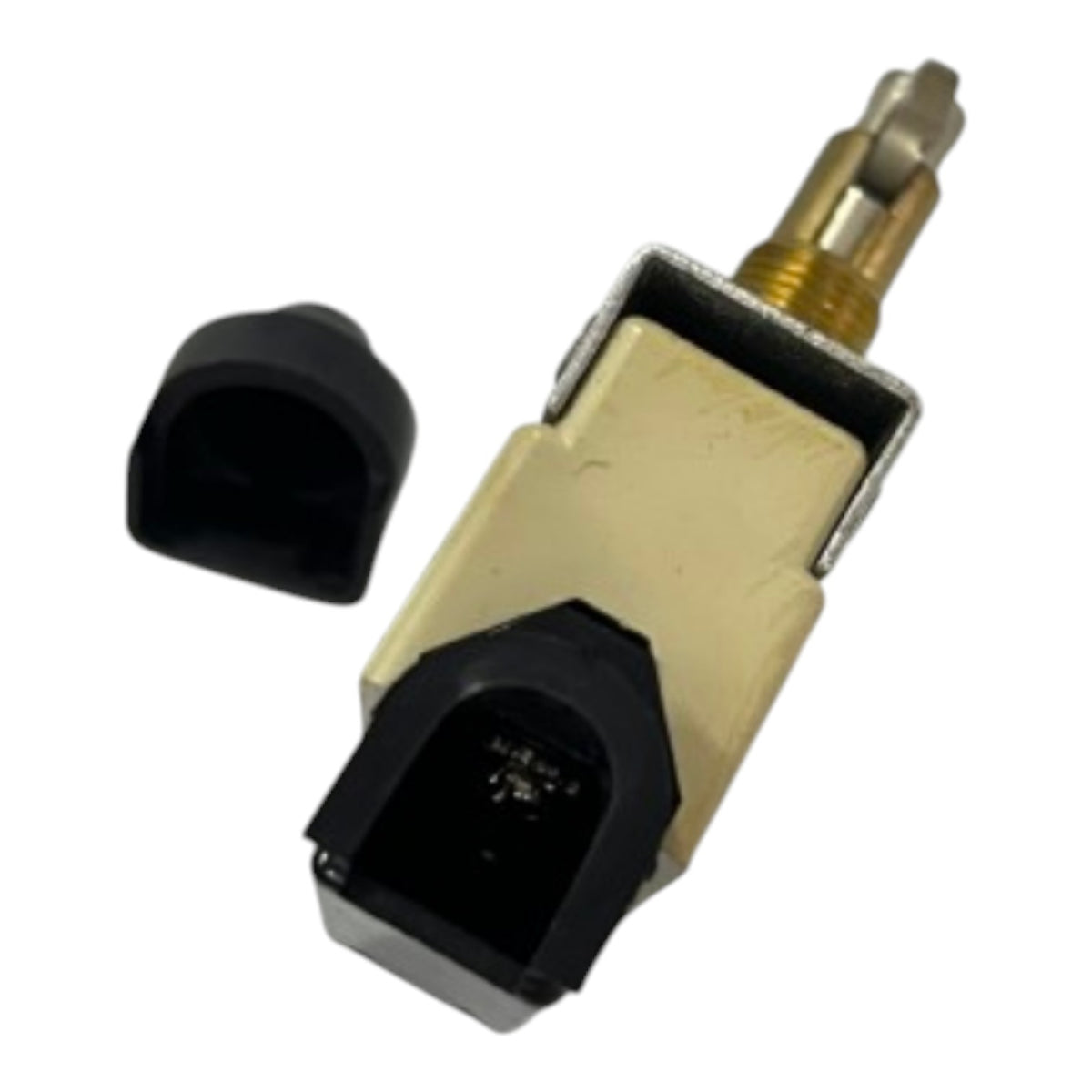A small automotive electrical component with a beige plastic housing, black connector housing, and a brass-colored terminal, shown with a separate black cap on a plain white background.