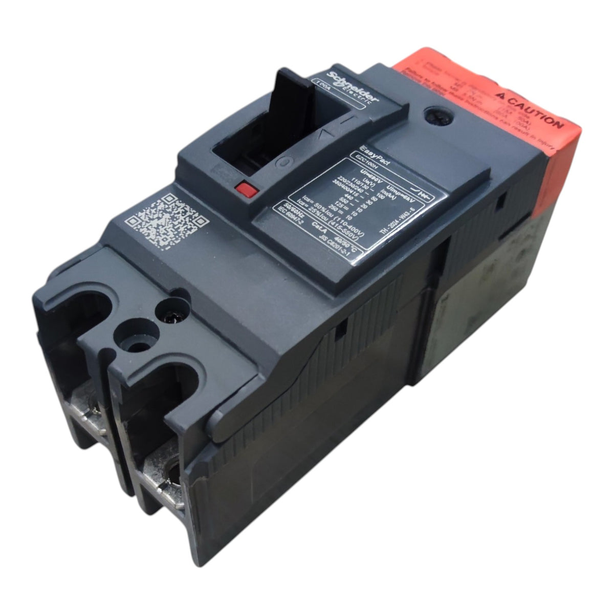 A Schneider Electric circuit breaker with a dark gray plastic housing, a bright orange-red terminal cover, and a black front handle, shown on a plain white background.