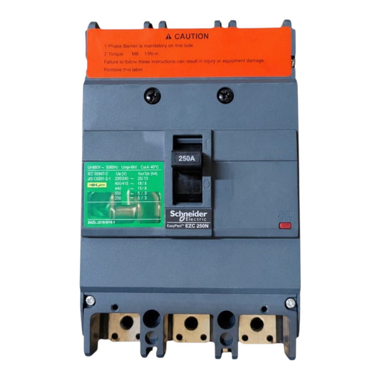 Schneider Electric EDC 250N circuit breaker with a dark gray housing, orange top warning label, green technical specification sticker, and gold-colored terminal blocks at the bottom, shown on a white background.