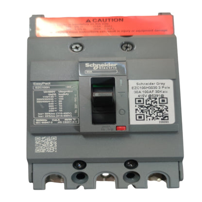 Schneider Electric EasyPact E2CC10003 3 Pole circuit breaker in grey plastic with a red top label and black switch, shown on a white background.