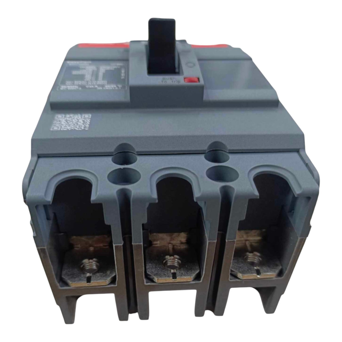 A three-terminal electrical circuit breaker with a gray plastic housing, three terminal compartments with exposed brass screw terminals, and a black top switch handle on a white background.