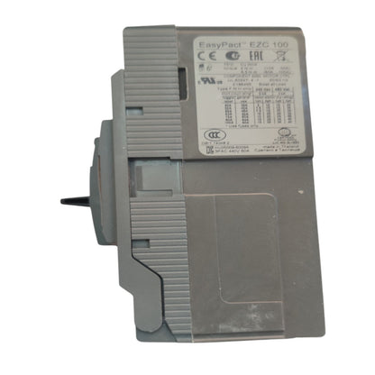 A gray EasyPact EZG 100 electrical contactor module with a white specification label, shown from a side angle on a white background.