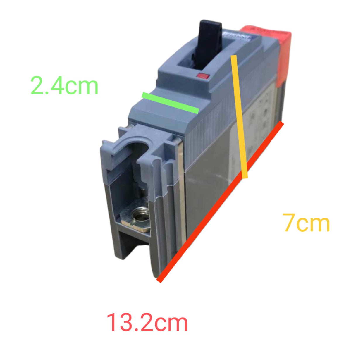 A gray electrical terminal block with dimension annotations showing 13.2cm length, 7cm depth, and 2.