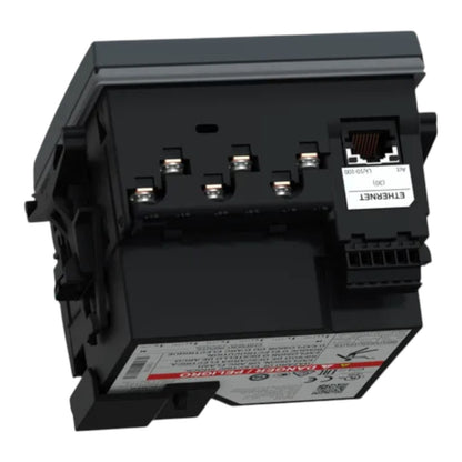 A black industrial electrical module with an RJ45 Ethernet port, terminal blocks, and printed technical labels, photographed on a plain white background.