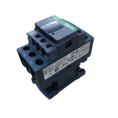 Schneider Electric contactor module in dark blue and gray with a green brand label, photographed on a white background.