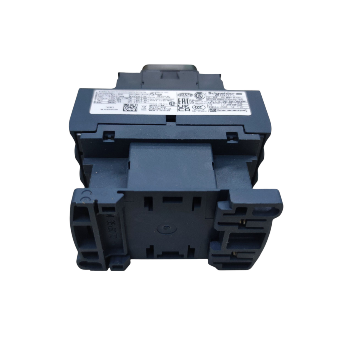 A dark blue-gray plastic electrical component or connector block with a white technical specification label on top, photographed against a solid white background.