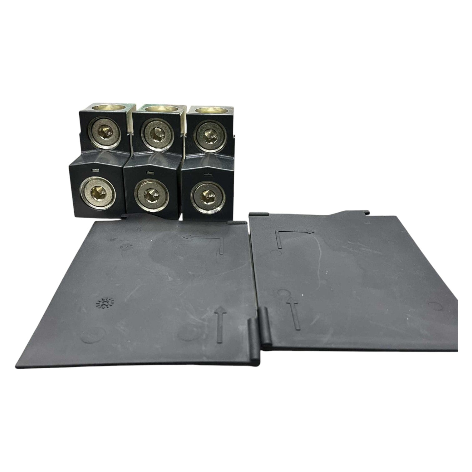 Set of black rubber mats with embossed designs on a white background