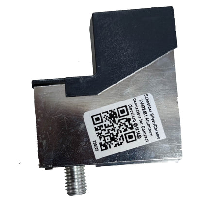 Metal component with a QR code label on a white background