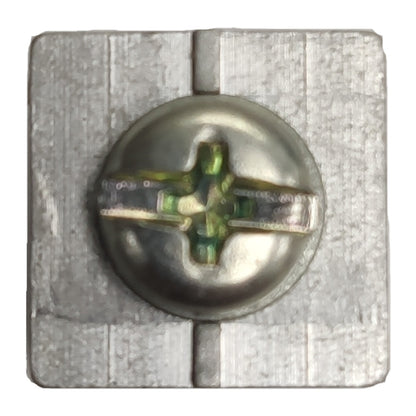 Metal screw with a star-shaped head on a textured metal background