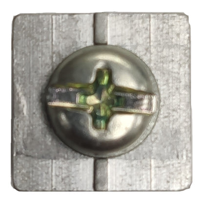 Metallic screw with a star-shaped head on a textured gray background