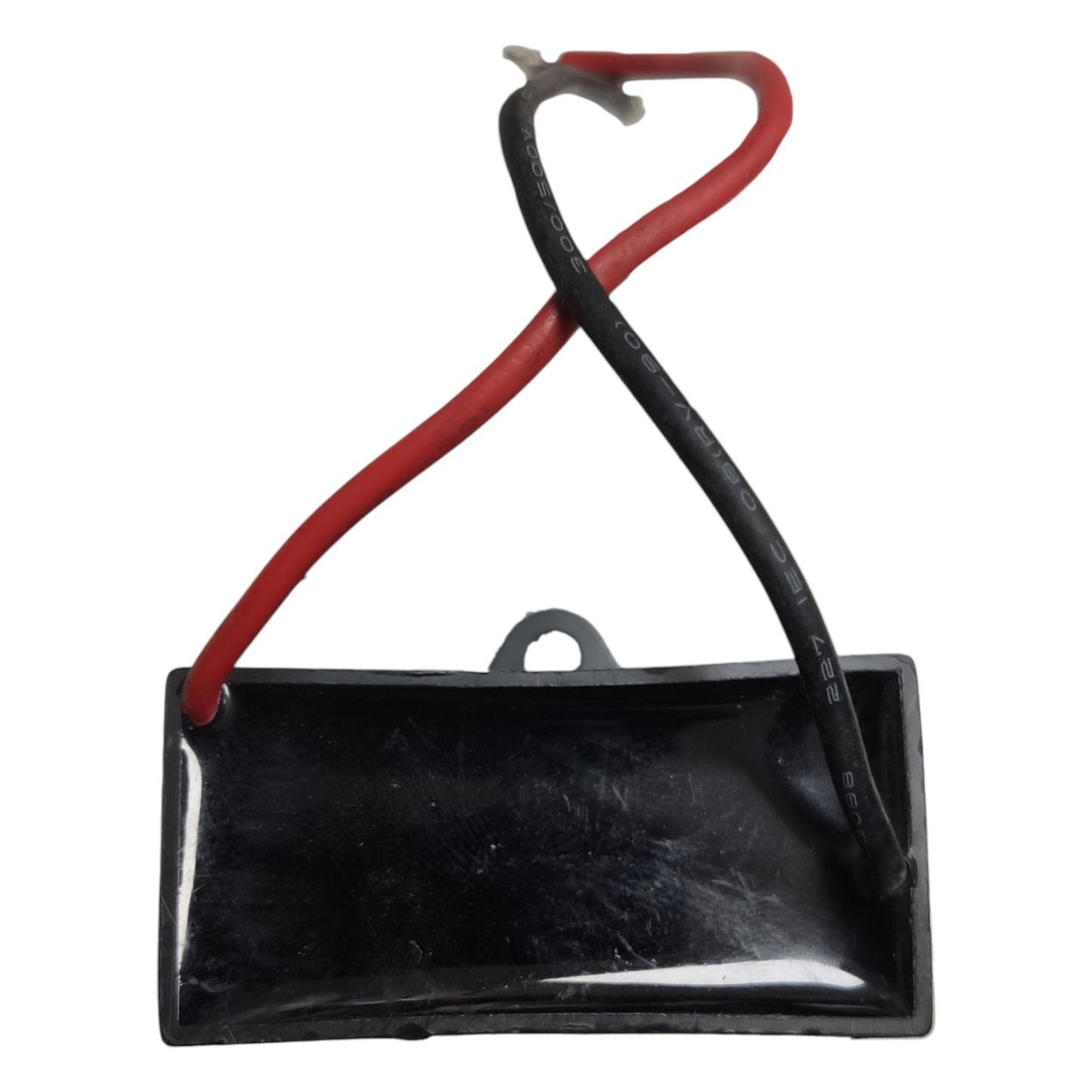 Black rectangular component with red and black wires on a white background