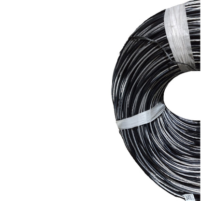 Coiled black cable on a white background