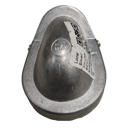 Metallic object with a label on a white background