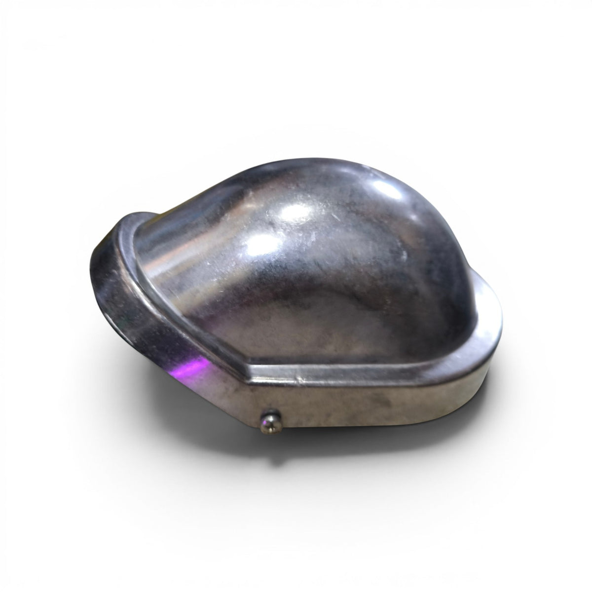 Metallic object with a heart-shaped design on a white background