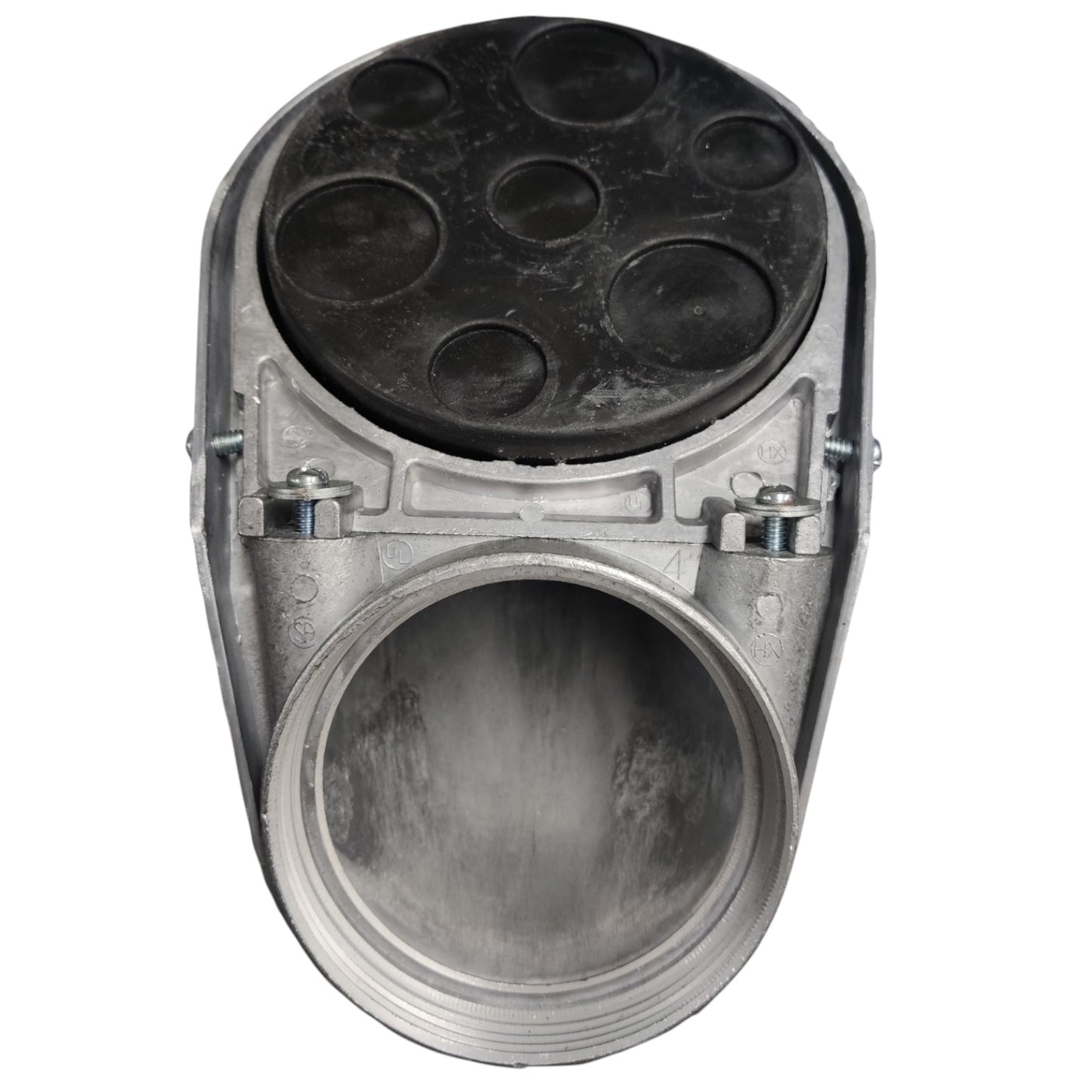 A metal automotive part with a large circular opening, a silver-toned body, and a black circular top plate with multiple recessed circular details, shown on a plain white background.
