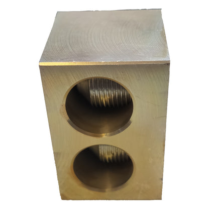 Metallic block with cylindrical holes on a white background