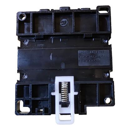 Black mechanical component with spring on a white background