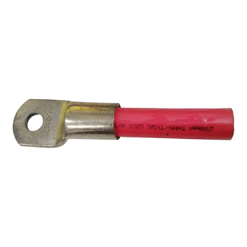 Metal and pink electrical connector on a white background