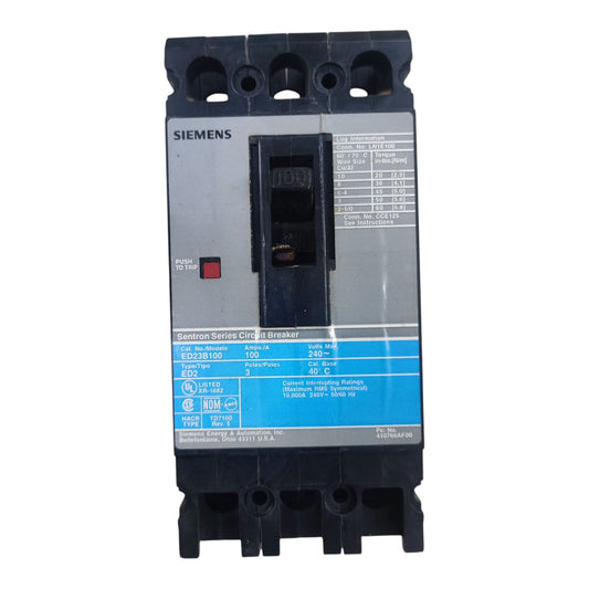 A Siemens 100A circuit breaker from the Sinwave Series C16, featuring a gray front panel with a blue label, black plastic housing, and a red power button.